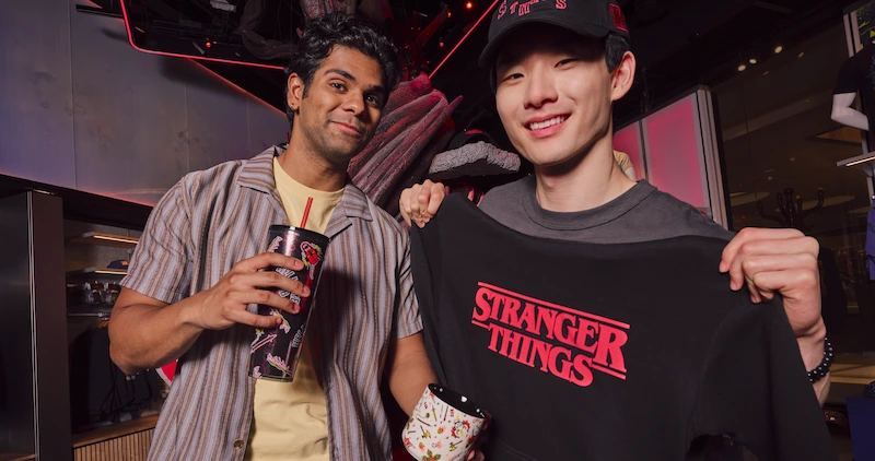 Two men shopping Stranger Things merch in Netflix retail