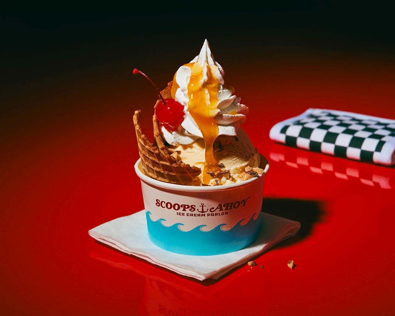 Butterscotch sundae with butterscotch ice cream, butterscotch sauce, waffle crisp, heath chunks