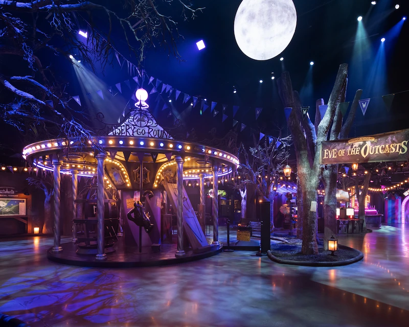 A merry-go-round is lit up as a part of the Wednesday Eve of the Outcasts festival.