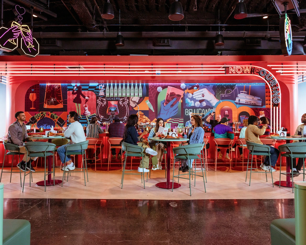 Groups of people sit together and eat at Netflix Bites.