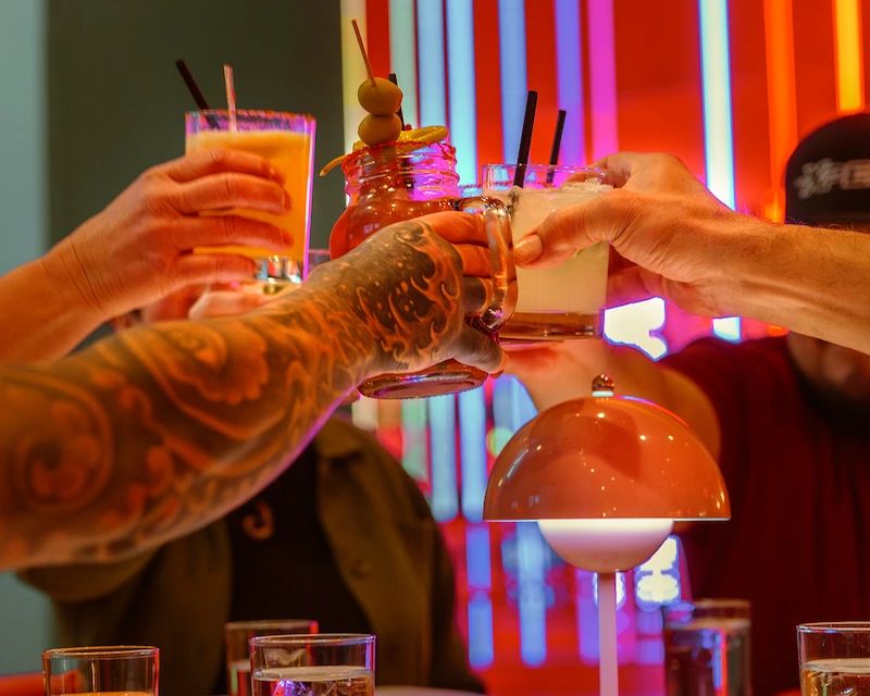 Friends cheering drinks at Netflix bites