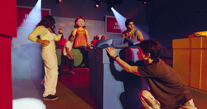 A group playing inside the Squid Game experience
