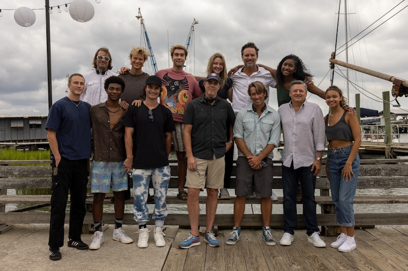Rudy Pankow, Austin North, Madelyn Cline, Charles Esten, Carlacia Grant, Drew Starkey, Jonathan Daviss, Chase Stokes, Director Jonas Pate, Ted Sarandos and Madison Bailey in Outer Banks Season 3 Behind-the-Scenes Photo Gallery