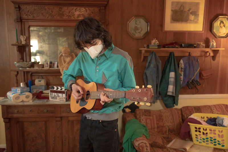 Wolfhard strumming along to the song that would save him from Vecna - 68 Behind-the-Scenes pics from ‘Stranger Things’ Season 4 You Have to See Slideshow
