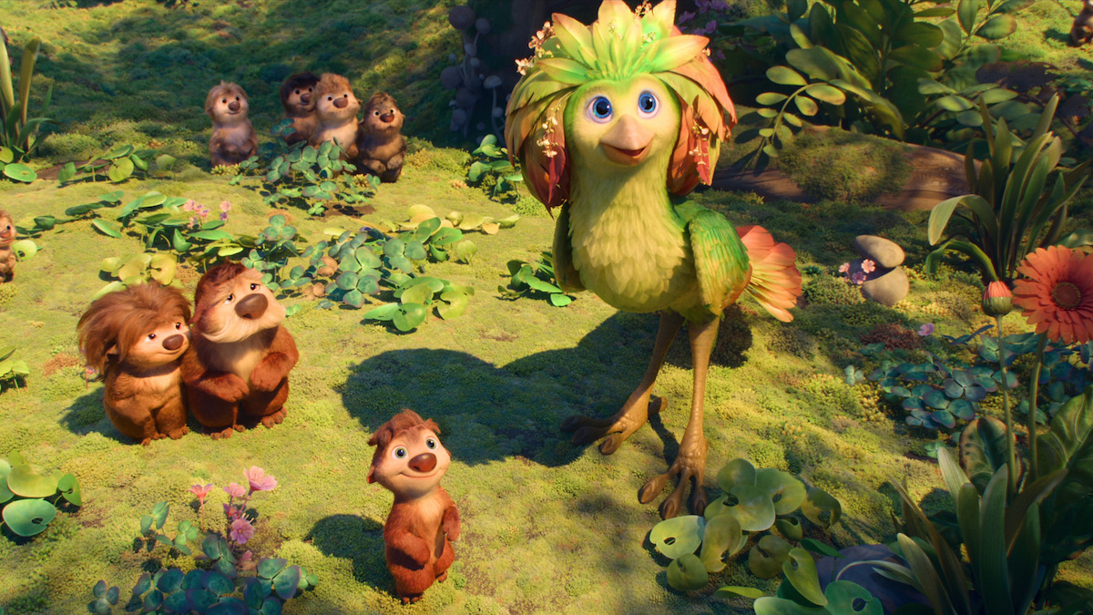 Animated scene of a cheerful green bird with a flower crest standing in a lush, sunny forest clearing, surrounded by several small, furry animals on a grassy, leafy ground with colorful flowers and plants.