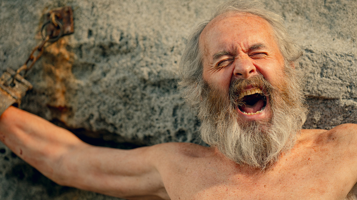 Stephen Dillane as as Prometheus screams while chained to a rock in Season 1 of ‘Kaos’