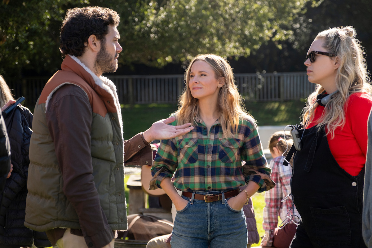 Adam Brody as Noah, Kristen Bell as Joanne and Erin Foster work together behind the scenes on the set of Nobody Wants This.