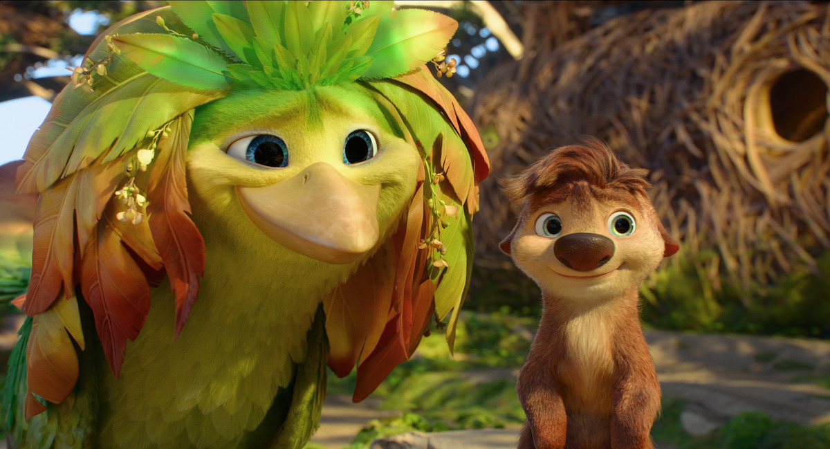 Animated colorful bird with leafy head beside small brown animal, both smiling in a bright, sunny forest with large nests and greenery in the background.