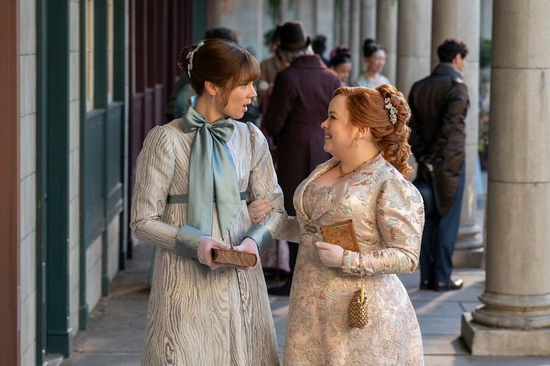 Claudia Jessie as Eloise Bridgerton and Nicola Coughlan as Penelope Featherington in ‘Bridgerton’ Season 4.