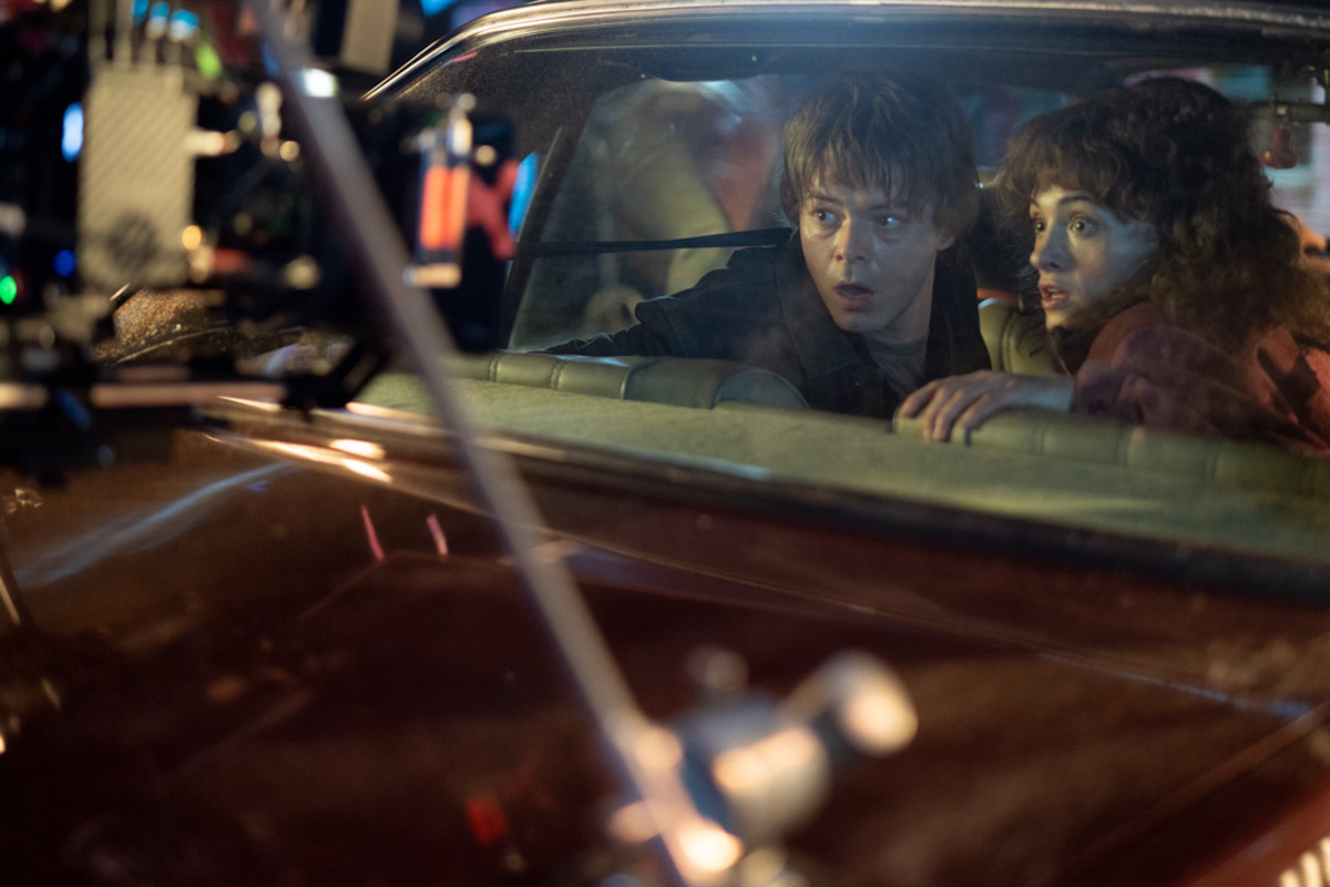 Behind-the-scenes photo of Charlie Heaton as Jonathan Byers and Natalia Dyer as Nancy Wheeler in ‘Stranger Things’ Season 5.