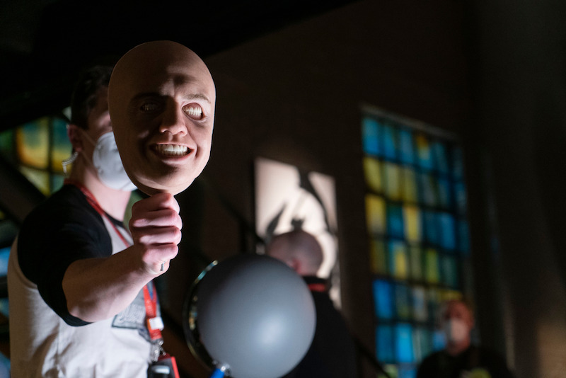 A very lifelike mask of the Corinthian (Boyd Holbrook) is held up.