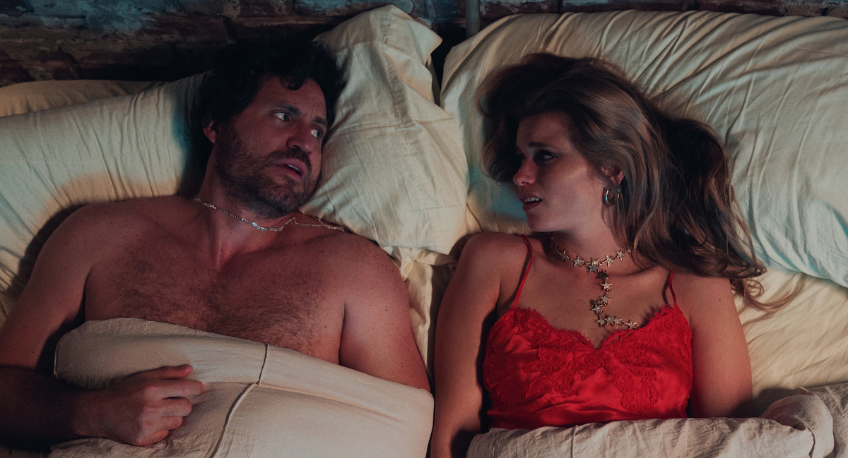 Abbey Lee as Delly West and Edgar Ramirez as Mike Valentine in Florida Man Season 1.