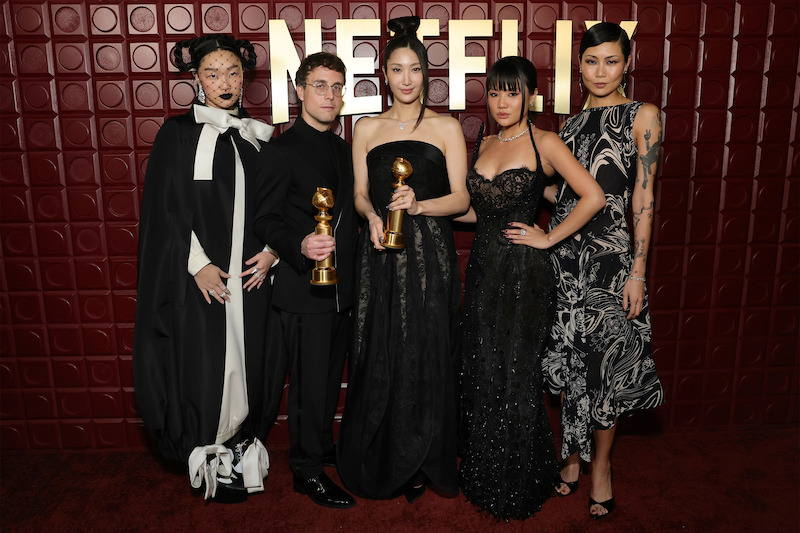 Audrey Nuna, Mark Sonnenblick, Ejae, Rei Ami and May Hong stand in front of a red backdrop. 