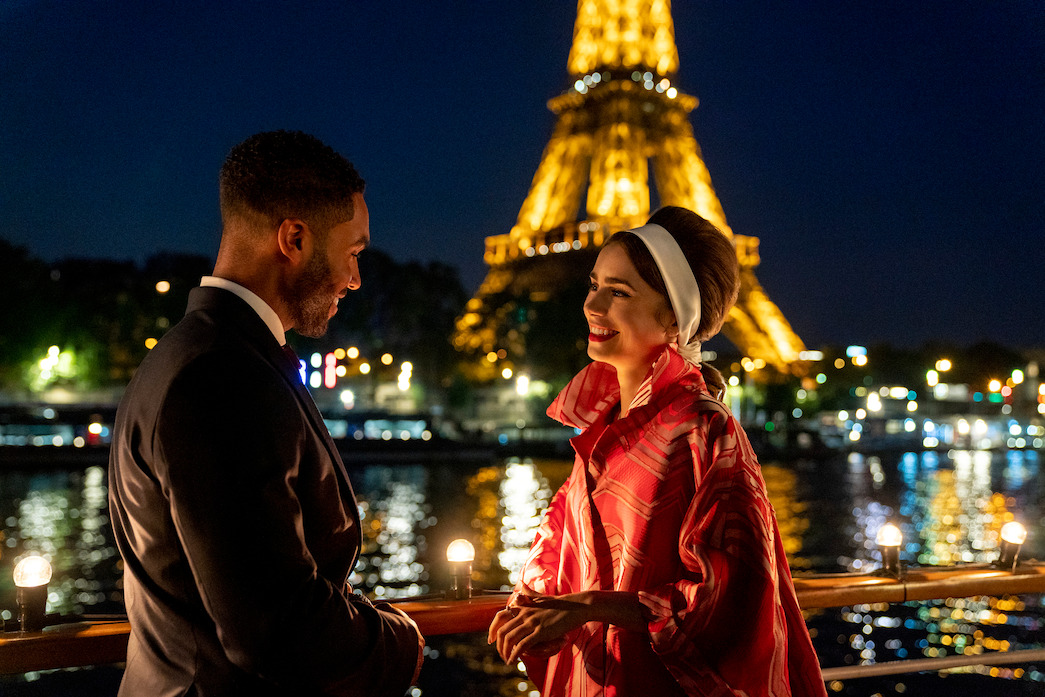 Alfie and Emily, with the Eiffel Tower lit up in the background