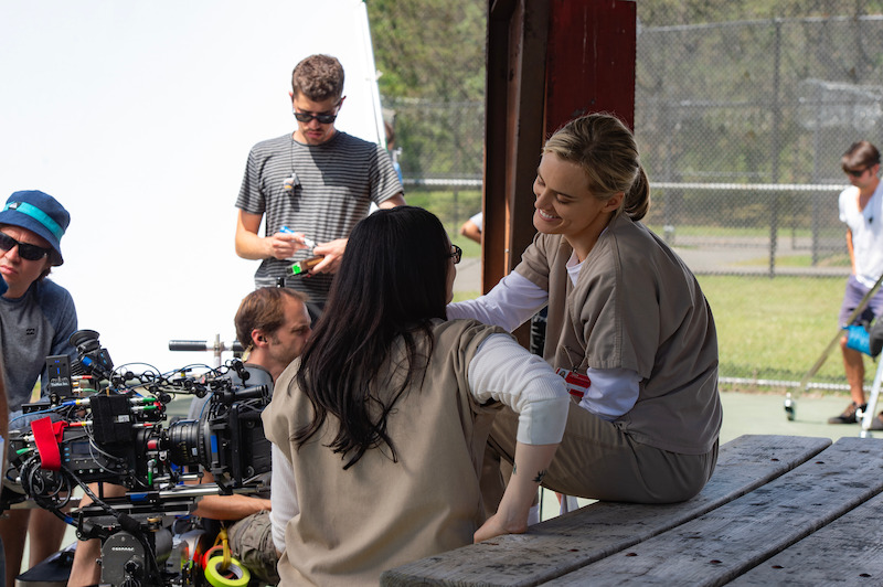 (L to R) Laura Prepon as Alex, Taylor Schilling as Piper on the set of Orange Is The New Black Season 3.