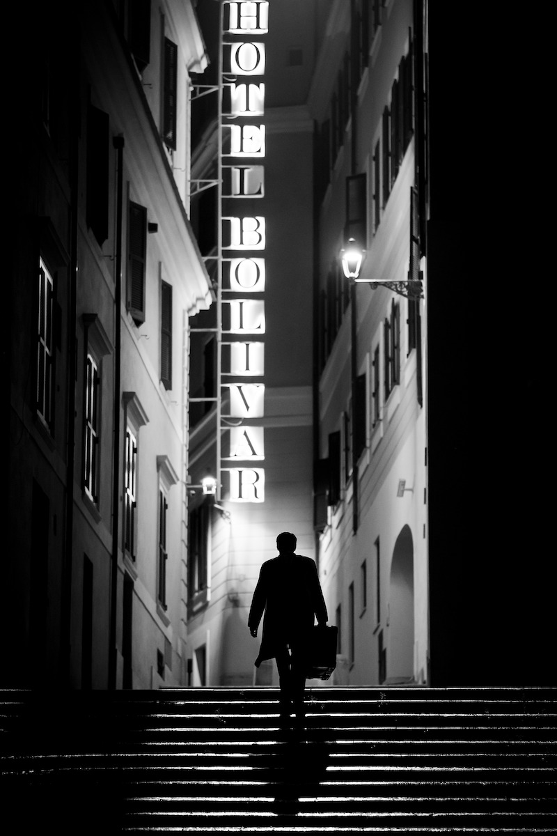 Andrew Scott as Tom Ripley walks through a city at night in 'Ripley'