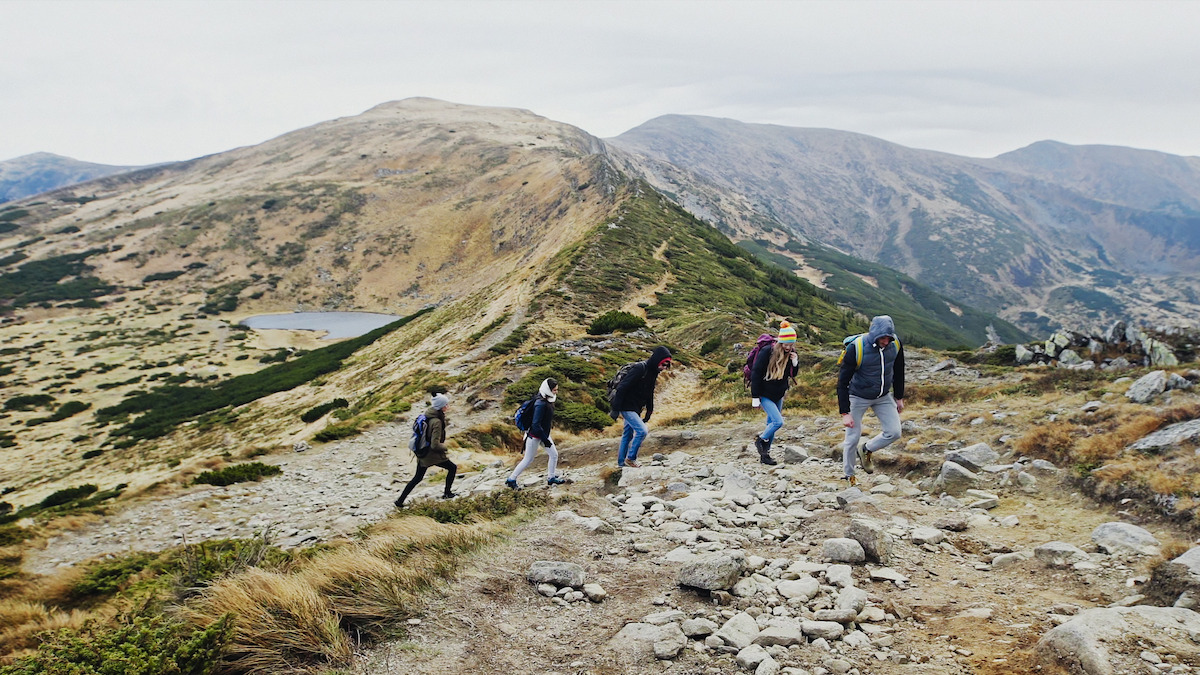 Treasure hunters hiking through the mountains