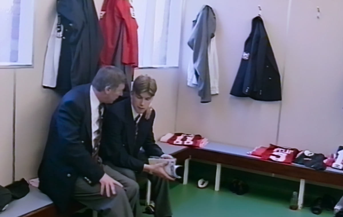 Sir Alex Ferguson sits with David Beckham.