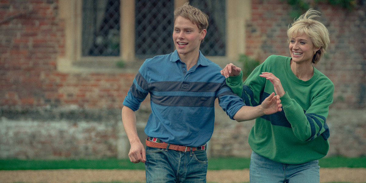 Prince William and Diana acting playful outside.