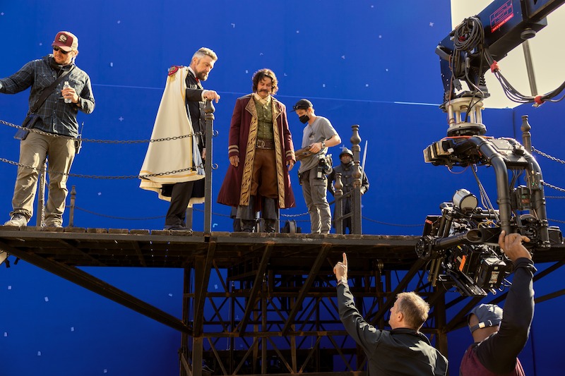 Vincent Regan as Vice Admiral Garp, Michael Dorman as Gold Roger, and director Marc Jobst on set of Season 1 of 'One Piece.'