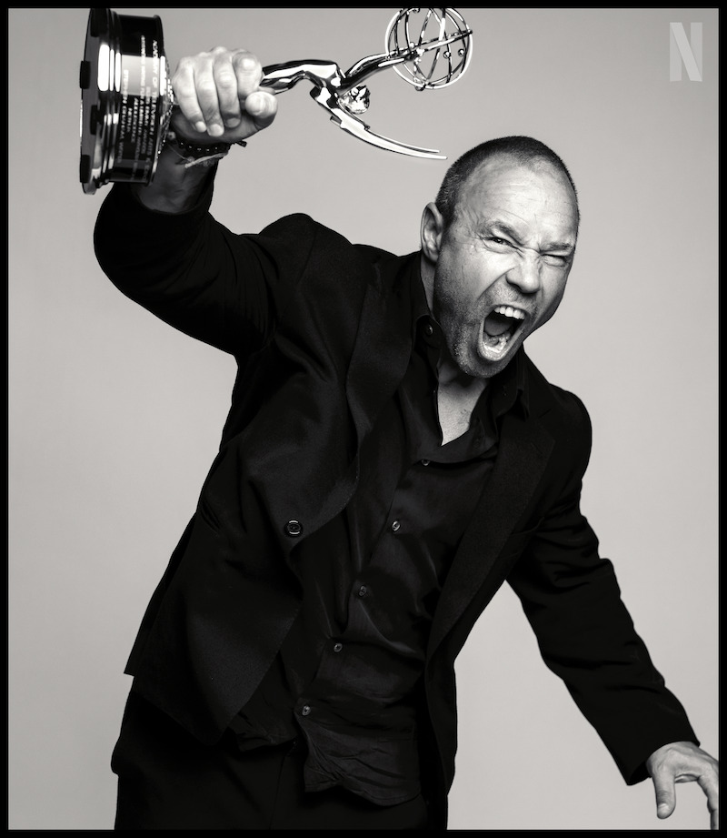 Stephen Graham holds up his Emmy Award as he poses for a photographer. 