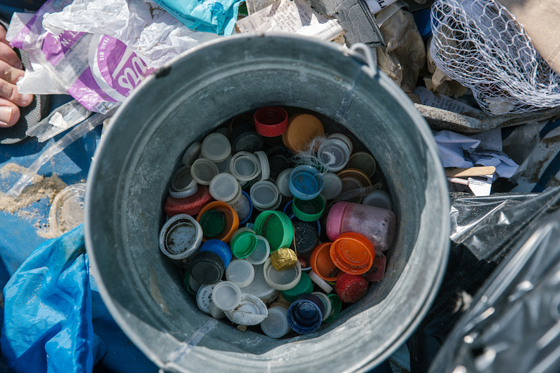 bucket of bottle caps