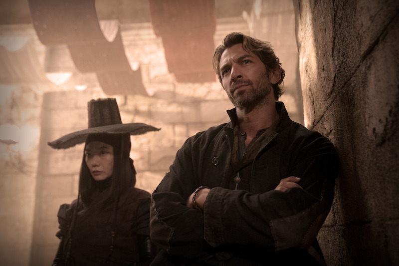 Doona Bae as Nemesis and Michiel Huisman as Gunnar in ‘Rebel Moon’