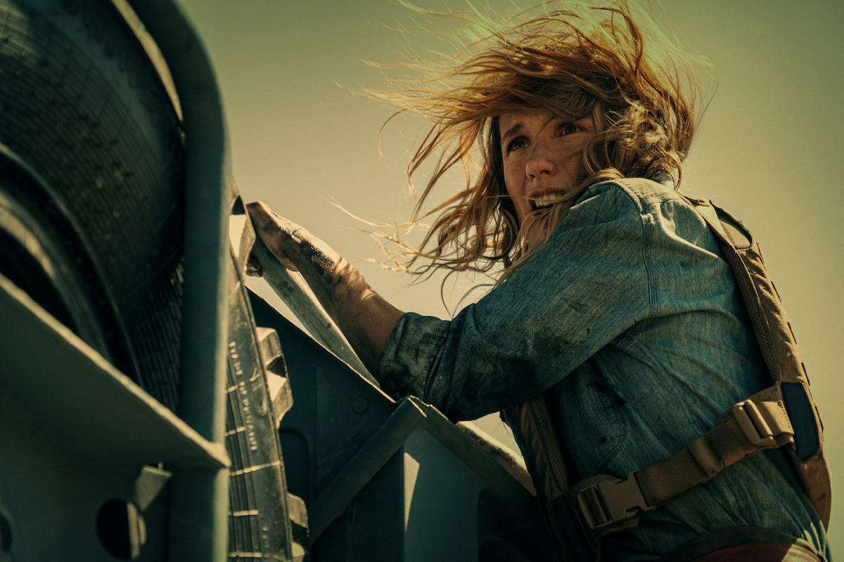Ana Girardot hangs off the side of a truck in ‘The Wages of Fear’