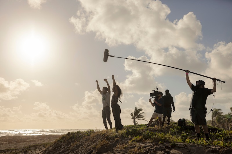 Jonathan Daviss as Pope and Carlacia Grant as Cleo in Outer Banks Season 3 Behind-the-Scenes Photo Gallery