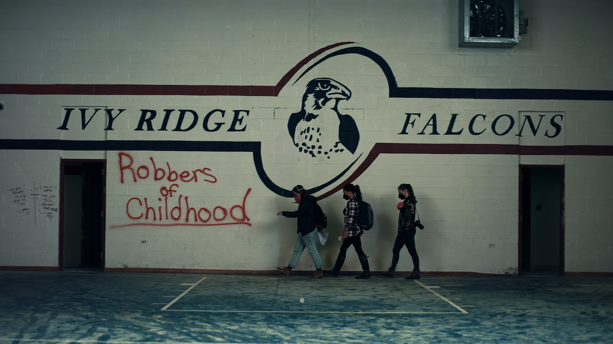 Former The Academy at Ivy Ridge students walking across the gymnasium.