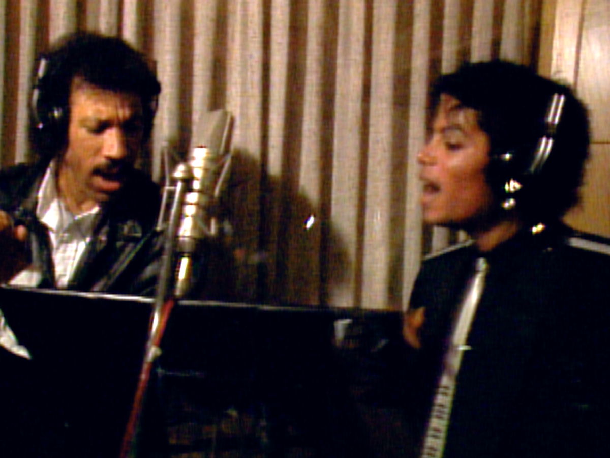 Lionel Richie and Michael Jackson singing.
