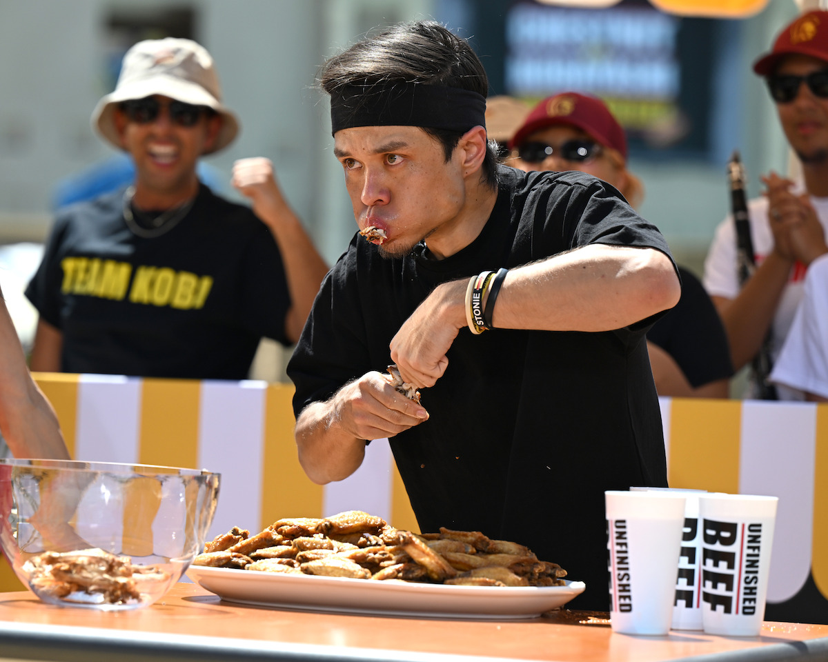Matt Stonie during his one-against-three chicken wing eating competition.