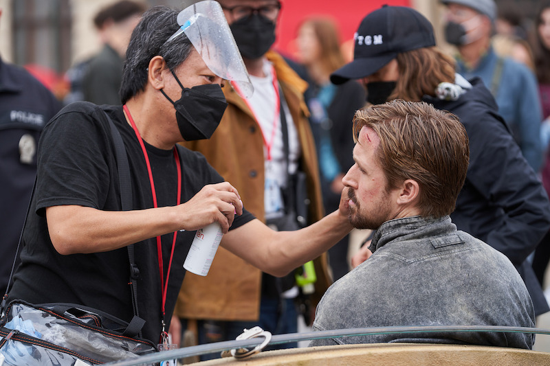 Gosling gets some bloody makeup applied between takes.
