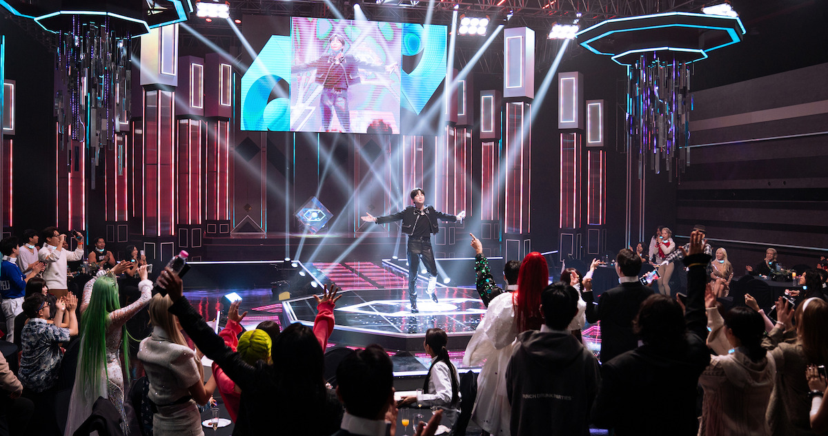 A man performs on stage in 'The Influencer'.
