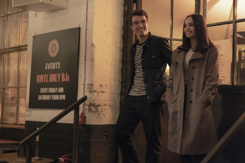 Corey Mylchreest as Jamie and Sofia Carson as Anna standing in front of a building in 'My Oxford Year'.