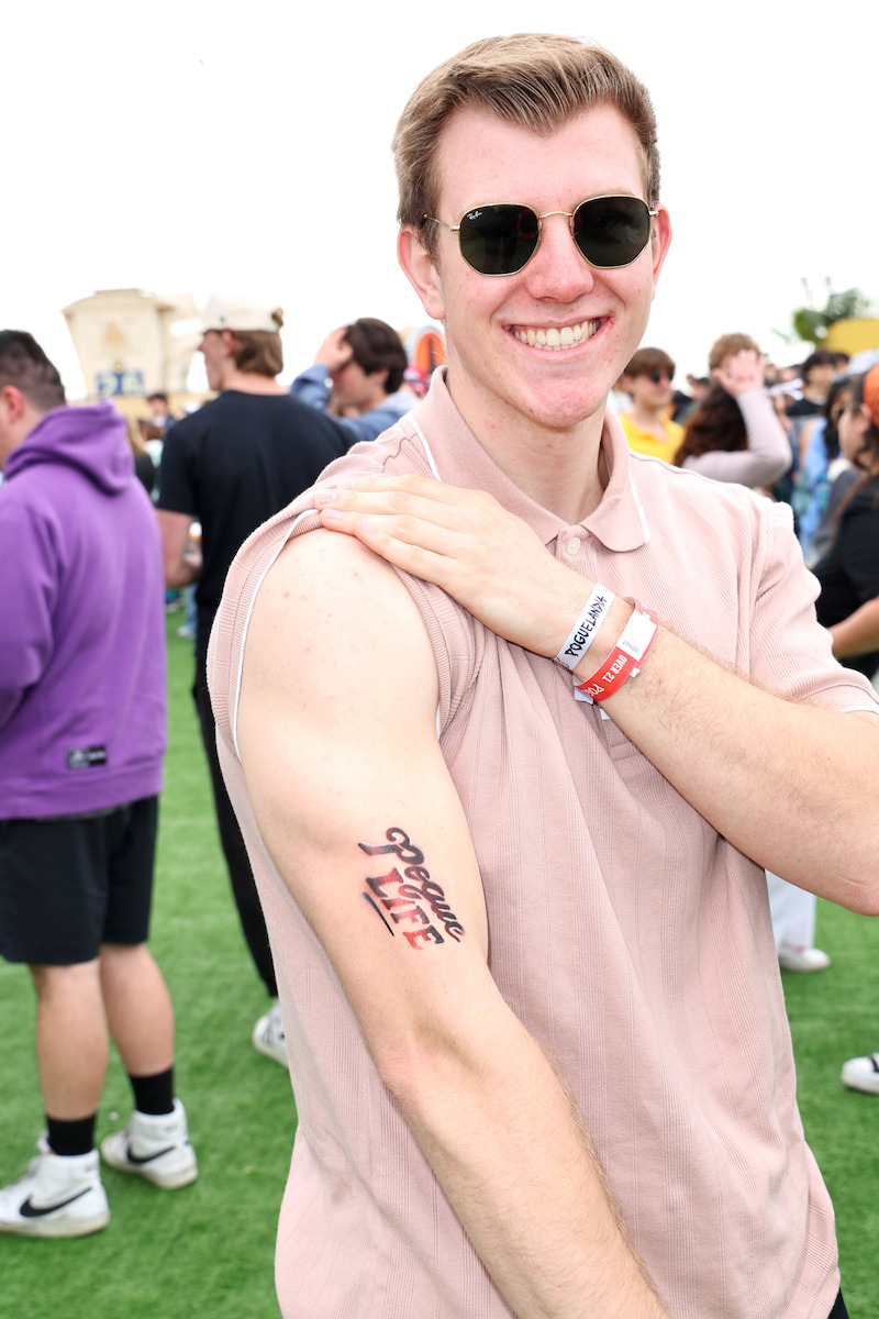 fan showing off temporary tattoo