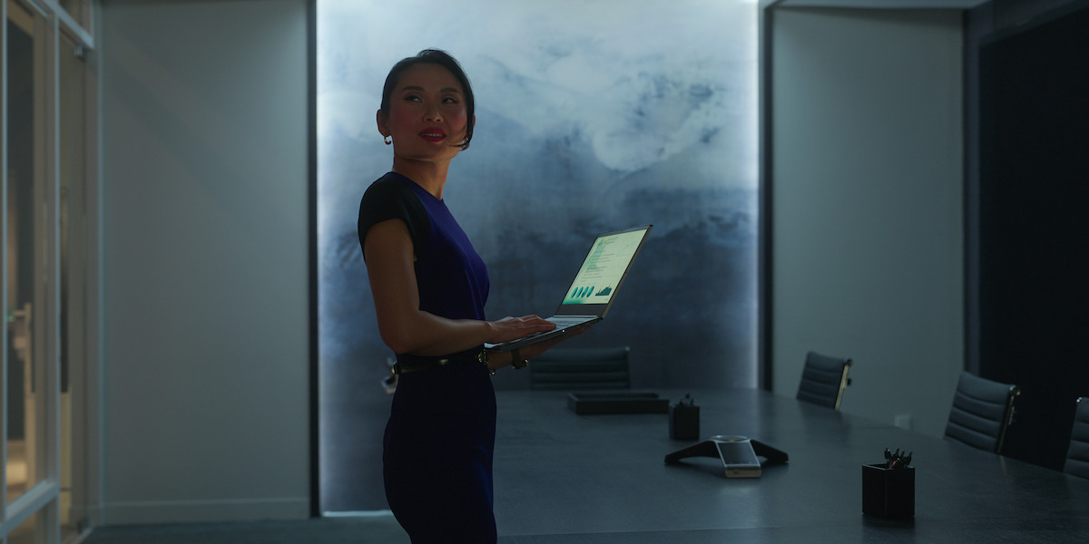 Li Jun Li  in a blue business dress as Francesca 