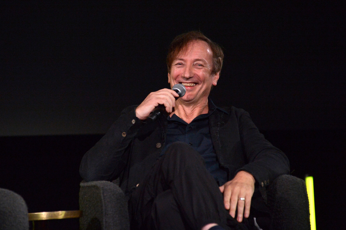 Volker Bertelmann sitting at a panel about Ballad of a Small Player