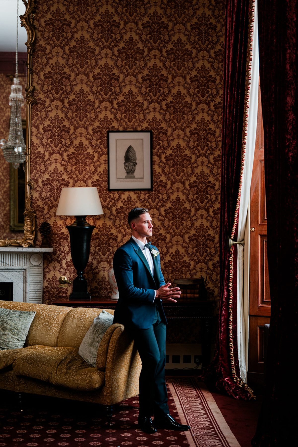 Freddie looks out the window in his wedding tux.