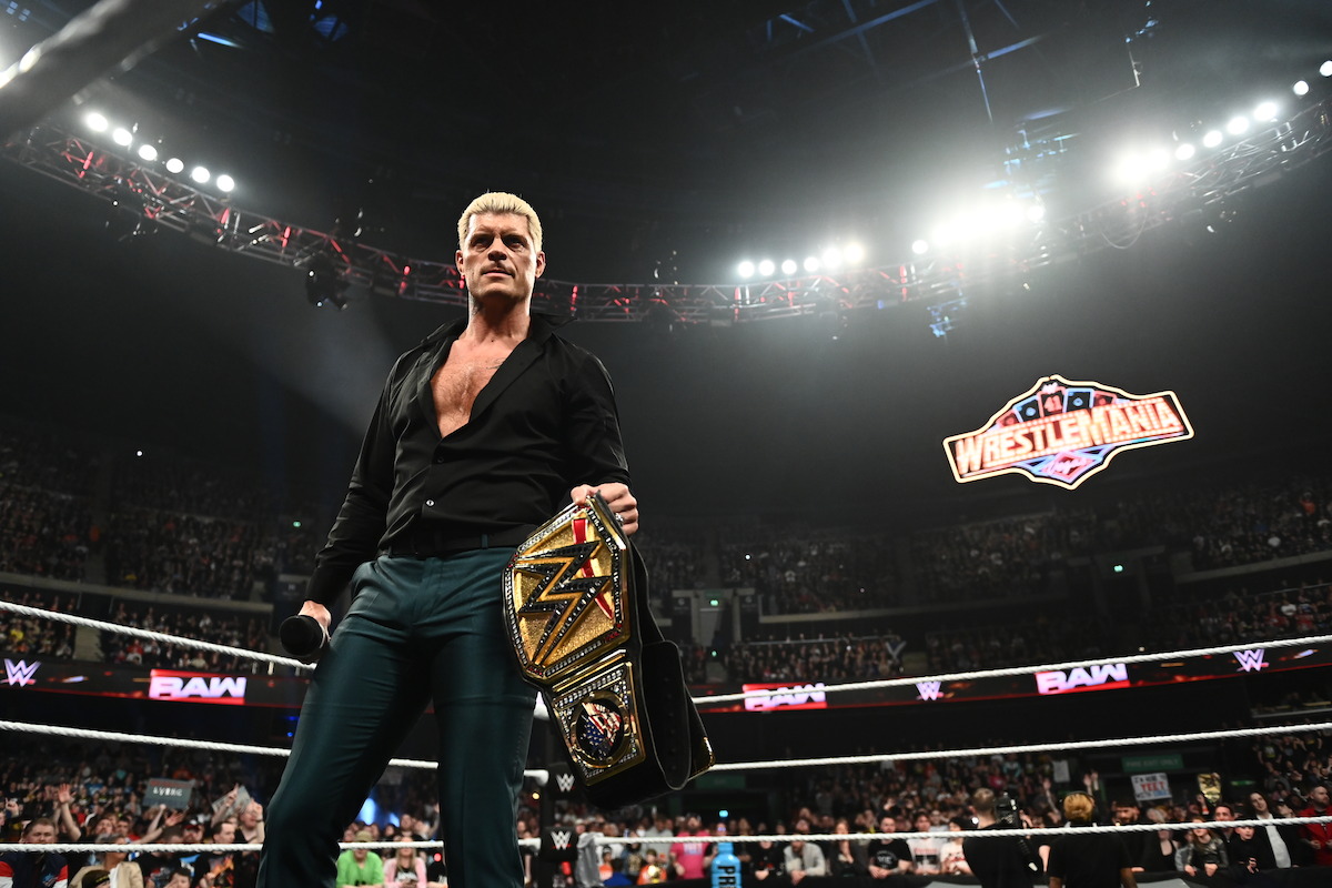 Cody Rhodes holds his belt in the ring.