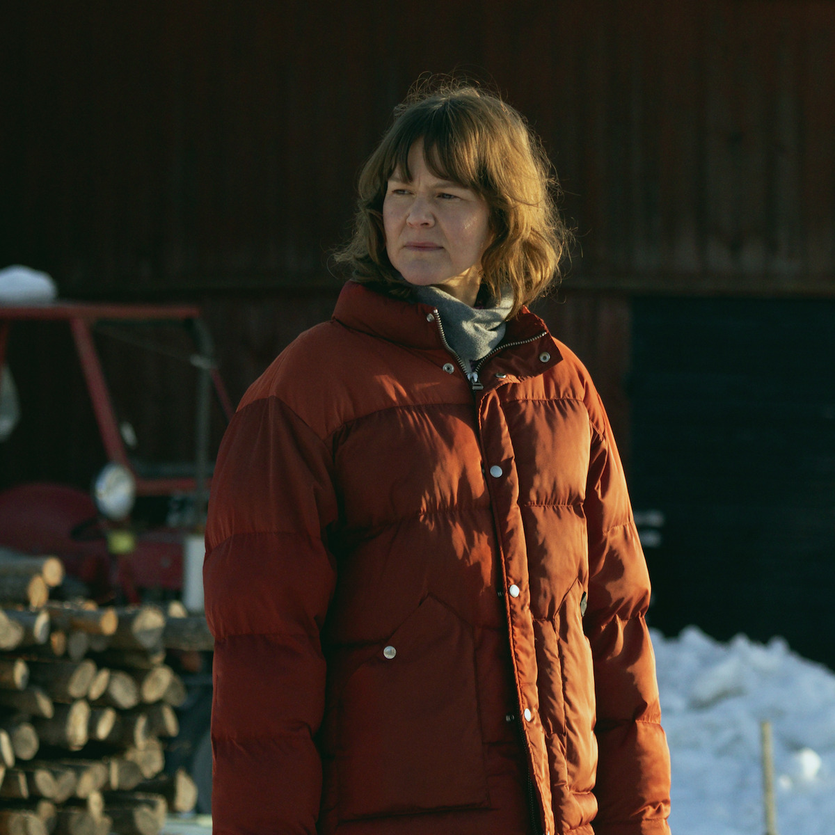 Malin Güettler as Annika stands outside wearing a red parka in ‘The Breakthrough.’