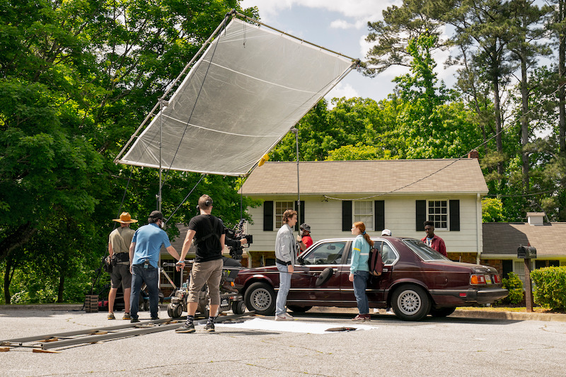 Steve doing what he does best: being a pretty damn good babysitter - 68 Behind-the-Scenes pics from ‘Stranger Things’ Season 4 You Have to See Slideshow