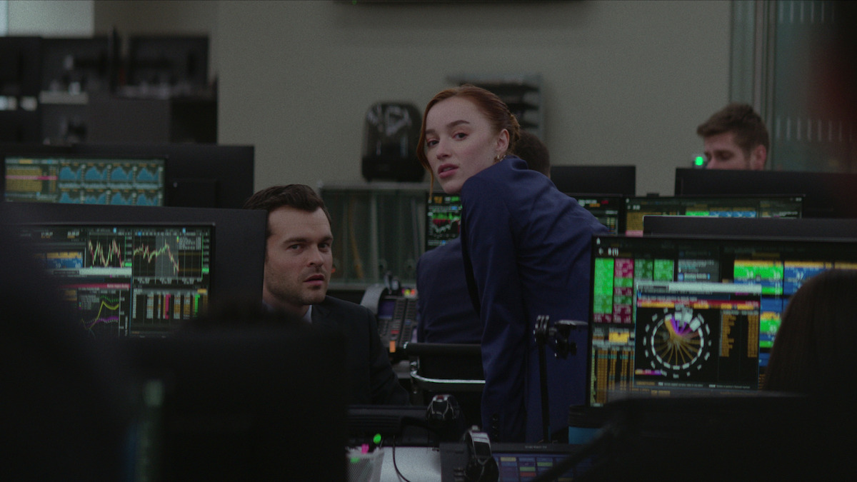 Alden Ehrenreich as Luke and and Phoebe Dynevor as Emily work in an office together in ‘Fair Play.’