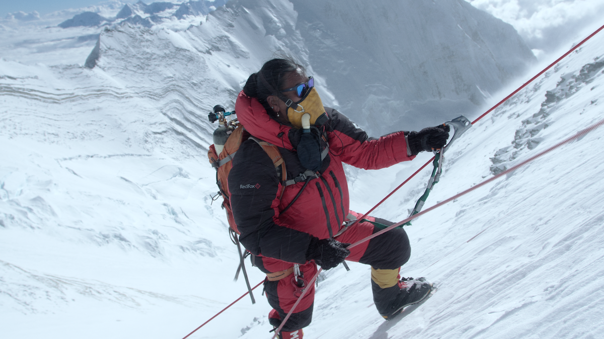Lhakpa Sherpa climbing with an oxygen mask.