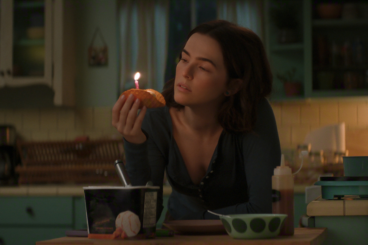 Zoey Deutch as Jill holds a dessert taco in 'Voicemails for Isabelle'