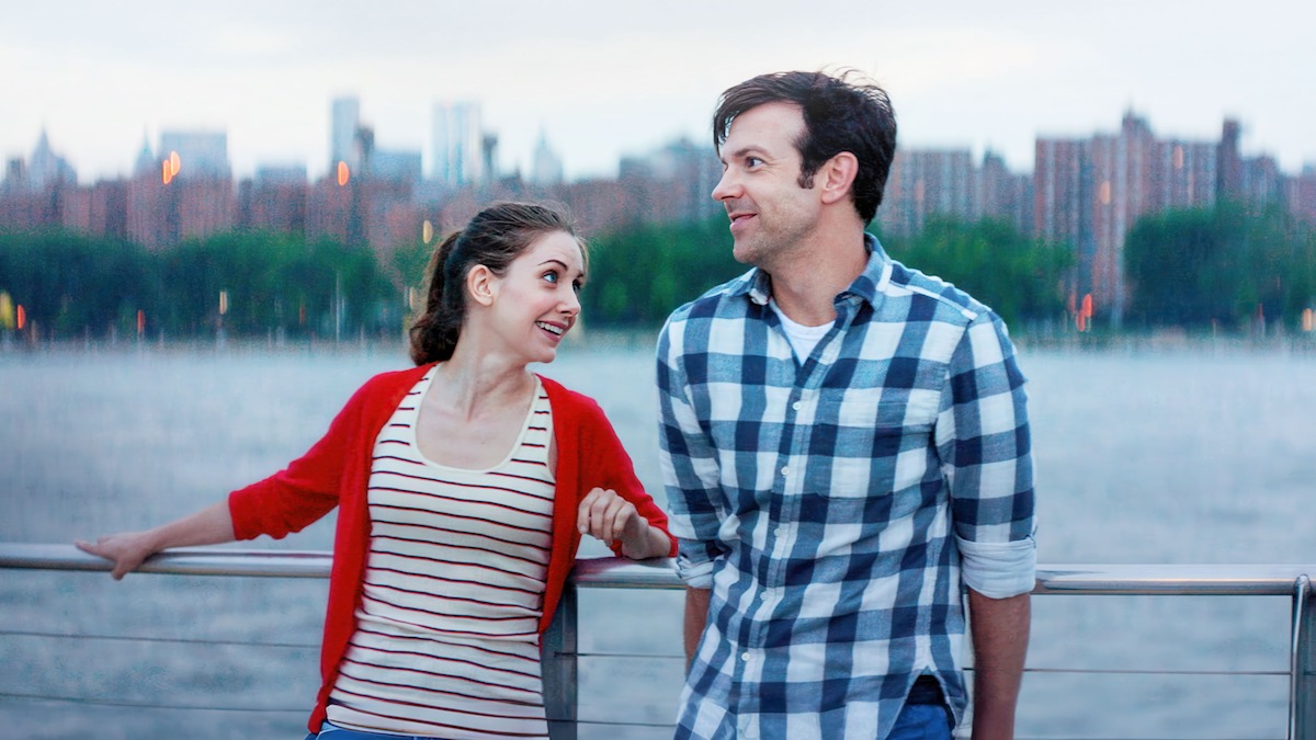 Jason Sudeikis as Jake and Alison Brie as Lainey on date by the river in ‘Sleeping with Other People.’