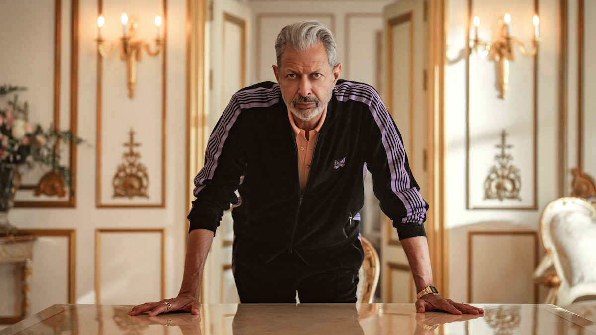 Jeff Goldblum as Zeus wears a purple tracksuit in Season 1 of ‘Kaos’