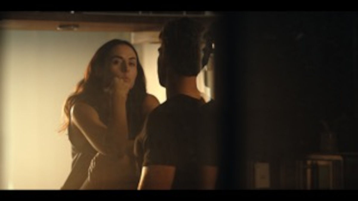 Zuria Vega as Helena in an intimate conversation with Andrés Baida as Iván in an image from ‘Unspeakable Sins.’