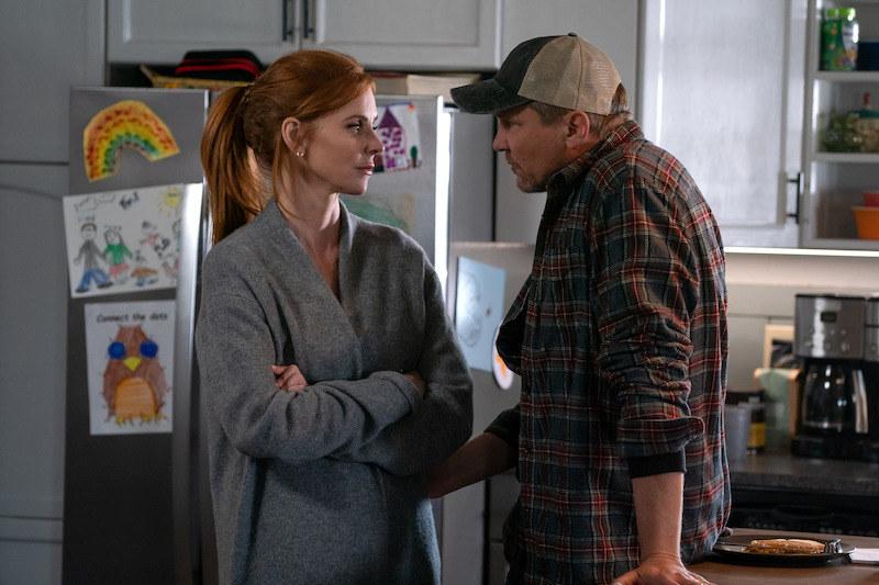 Sarah Rafferty as Katherine and Marc Blucas as George have a discussion in a kitchen in Season 1 of ‘My Life with the Walter Boys.’