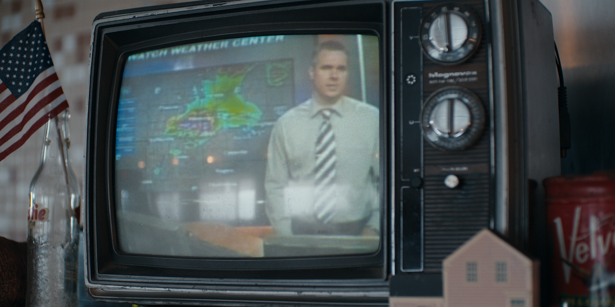 A shot of a television broadcasting weather forecaster Doug Heady’s storm coverage in a still image from ‘The Twister: Caught in the Storm.’